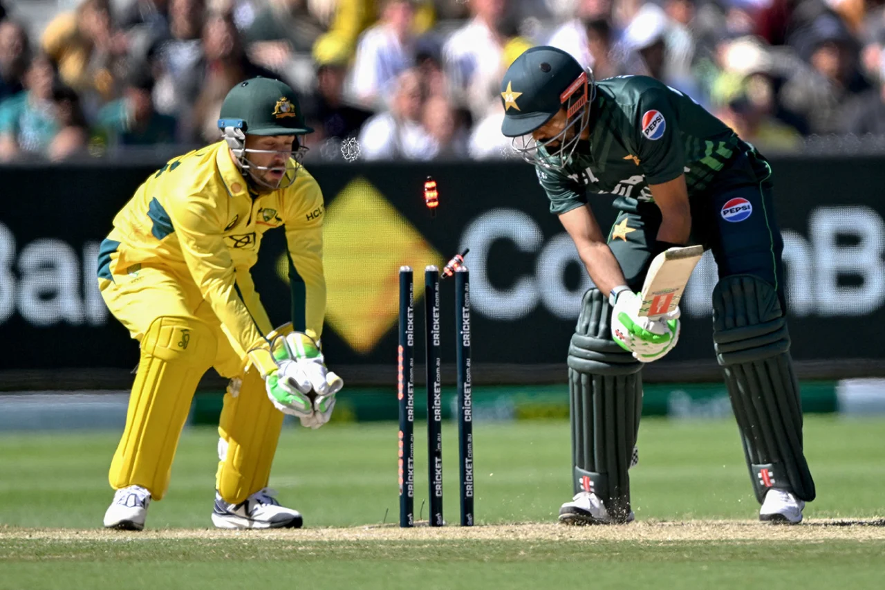 The cricketing world witnessed an intense clash between Pakistan and Australia in the 1st ODI of the series at the iconic Melbourne Cricket Ground (MCG) on November 4, 2024. In a game that was as thrilling as it was competitive, Australia managed to edge out Pakistan by 2 wickets, chasing down the target of 204 runs with 99 balls remaining.

Let’s dive into the details of this nail-biting encounter.

Pakistan’s Innings – Struggles and Highlights

Score: 203 all out (44.6 overs)

After winning the toss, Australia put Pakistan in to bat. Pakistan’s innings started with a tough challenge, as Australia’s fast bowlers were in exceptional form. Pakistan’s openers, Abdullah Shafique and Sami Ayub, struggled to establish a strong start. Shafique was dismissed for a brisk 20 off 16 balls, followed shortly by Ayub, who contributed 8 runs from 17 deliveries. The early dismissals left Pakistan at 22/2, under pressure right from the beginning.

Key Players in the Middle Order:

	•	Babar Azam showed resilience with his 37 off 64 balls, anchoring Pakistan’s innings despite the early setbacks. His innings was cut short by Adam Zampa, who bowled him, reducing Pakistan’s chances of a high total.
	•	Mohammad Rizwan tried to stabilize the innings alongside Babar but was dismissed for 44 off 60 deliveries by Pat Cummins. Rizwan’s performance was notable as he took on the responsibility of guiding the innings after early losses.
	•	Kamran Ghulam chipped in with a useful 26 off 32 balls, but his dismissal came at a crucial moment, adding pressure on the lower order.

Pakistan’s lower-middle order, including Salman Agha and Irfan Khan, couldn’t provide the expected momentum, with both getting dismissed in the single digits. However, Shaheen Shah Afridi provided some late firepower with a quick 24 off 19 balls, hitting two sixes in his cameo before being bowled by Starc.

Australia’s Bowling Performance:
Australia’s bowlers maintained a tight grip throughout Pakistan’s innings, particularly Mitchell Starc, who claimed the title of Player of the Match with his figures of 3/33 in 10 overs. Starc’s deadly pace and accurate bowling consistently troubled Pakistan’s batsmen. Pat Cummins also contributed significantly, taking 3 wickets for 34 runs in his 9.4 overs, including the important wicket of Mohammad Rizwan. Adam Zampa proved his worth as a spinner with 2/46, dismantling Pakistan’s batting lineup alongside the pacers.

Pakistan was bowled out for 203 in 44.6 overs, setting Australia a moderate target of 204 runs.

Australia’s Chase – Pakistan’s Fierce Bowling vs. Australia’s Resilience

Target: 204 runs in 50 overs
Final Score: 204/8 in 33 overs

Australia’s innings got off to a shaky start as Pakistan’s bowlers struck early. Shaheen Shah Afridi and Naseem Shah delivered intense opening spells, removing both openers, Matthew Short and Jake Fraser-McGurk, within the first 8 overs. Australia found themselves at 22/2, and the game seemed balanced at this stage.

Middle Order Contributions:

	•	Steven Smith stepped up for Australia with a steady 46 off 73 balls, but he couldn’t convert it into a match-winning knock. His dismissal by Shaheen Afridi brought Pakistan back into the game.
	•	Josh Inglis added 49 runs off 44 balls, providing the necessary acceleration. He was ultimately dismissed by Irfan Khan, but his innings played a vital role in keeping Australia in the hunt.
	•	Marnus Labuschagne made a brisk 39 from 22 balls, injecting momentum into the innings before being dismissed by Haris Rauf.

As wickets fell regularly, Pakistan kept Australia under pressure, defending their low total admirably. At one point, Australia was 170/7, and Pakistan sensed an opportunity to pull off a remarkable victory.

Lower Order Heroics:
Australia’s captain Pat Cummins played a crucial role in steering the team towards victory with an unbeaten 32 off 31 balls. His composure under pressure allowed Australia to inch closer to the target. Despite Pakistan’s tight bowling and fielding, Cummins’ experience and resilience shone through, helping Australia cross the finish line with 2 wickets in hand.

Pakistan’s Bowling Standout Performers:
Pakistan’s bowlers displayed exceptional skill and tenacity, making Australia’s chase anything but easy:

	•	Shaheen Shah Afridi was brilliant with figures of 3/42 in 10 overs, taking vital wickets and keeping Pakistan in the game.
	•	Haris Rauf bowled aggressively, taking 2 wickets for 44 runs in his 9 overs.
	•	Mohammad Hasnain also chipped in with a key wicket, while Naseem Shah’s economical spell kept the scoring in check.

Despite their best efforts, Pakistan’s bowlers couldn’t completely break Australia’s lower order, and Australia eventually chased down the target in 33 overs.

Match Summary

	•	Result: Australia won by 2 wickets.
	•	Player of the Match: Mitchell Starc (AUS) – 3 wickets for 33 runs
	•	Top Scorers:
	•	Pakistan: Mohammad Rizwan – 44 (60), Babar Azam – 37 (64)
	•	Australia: Josh Inglis – 49 (44), Steven Smith – 46 (73)

Key Takeaways

	1.	Australia’s Bowlers Lead the Charge:
Mitchell Starc’s lethal pace and Pat Cummins’ disciplined bowling were instrumental in restricting Pakistan to a modest total. The Australian bowling attack showed why they are one of the best, with their bowlers adapting seamlessly to the pitch conditions.
	2.	Pakistan’s Fighting Spirit:
Despite posting only 203 runs, Pakistan’s bowlers put up a valiant fight, striking regularly to keep Australia on edge. Shaheen Afridi and Haris Rauf’s combined efforts nearly pulled off an incredible defense.
	3.	Middle Order Strength:
Australia’s middle order played a key role in stabilizing the innings after the early setbacks. The contributions from Steven Smith and Josh Inglis were essential to their chase, providing the backbone that allowed Cummins to finish the job.
	4.	Resilient Leadership by Pat Cummins:
Cummins not only contributed with the ball but also held his nerve in the chase, demonstrating his all-round abilities and leadership. His calm and collected approach under pressure ultimately guided Australia to victory.

Conclusion

The 1st ODI between Pakistan and Australia at Melbourne was a closely contested affair, showcasing the strengths of both teams. Australia’s victory by 2 wickets sets an exciting tone for the series, as Pakistan’s bowlers proved they can challenge one of the world’s best batting lineups, even with a low total. This thrilling encounter has raised anticipation for the upcoming matches, promising more competitive cricket.